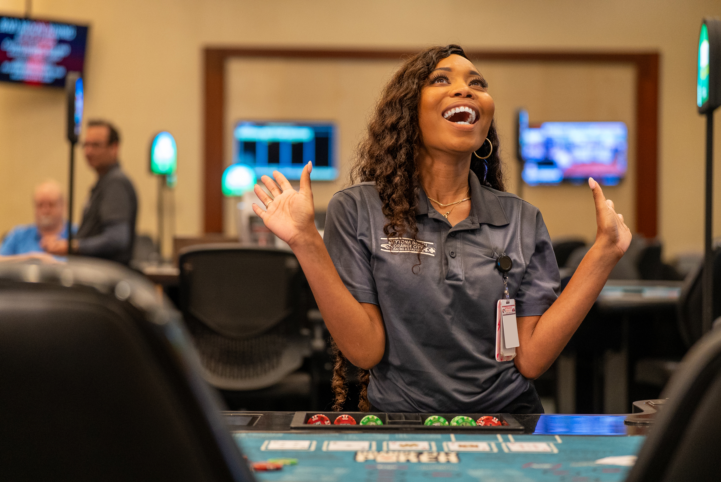 Dealer cheering at a poker table